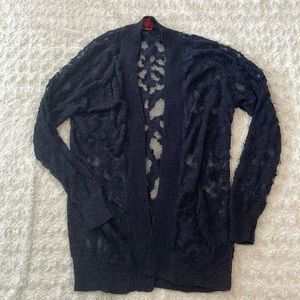 Size S navy sweater. Runs more like a M